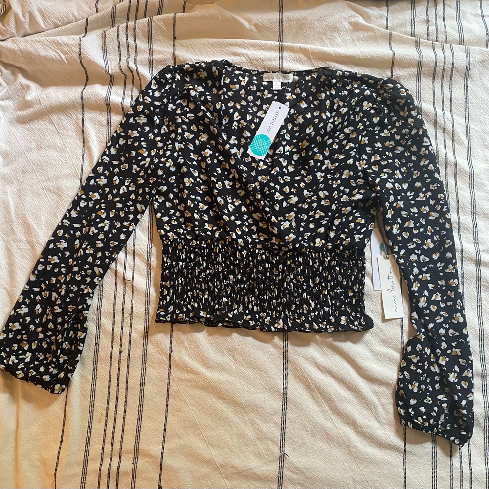 Nine Britton Wrap-style top with smocked bottom S